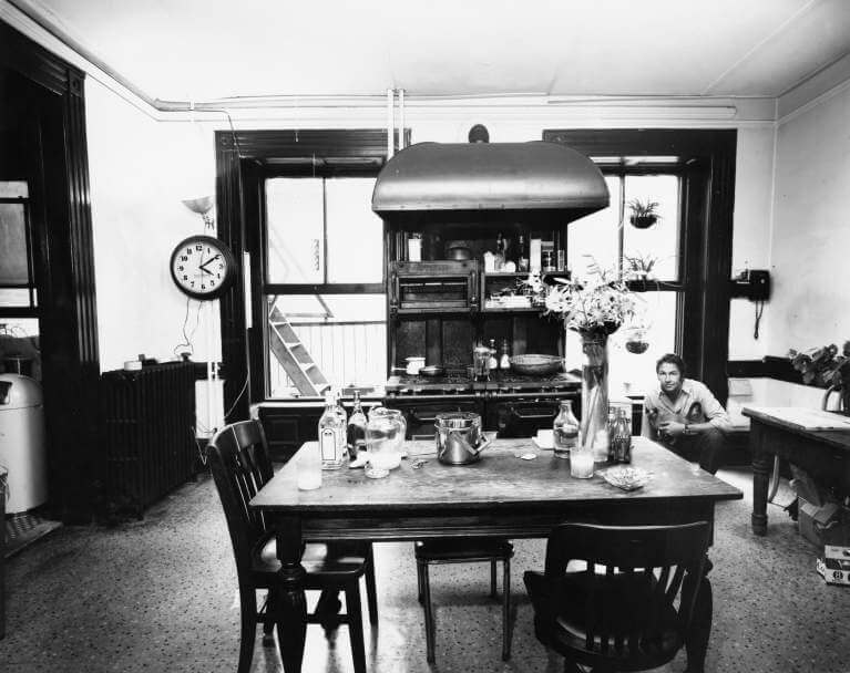 Robert Rauschenberg in his kitchen at 381 Lafayette, 1968